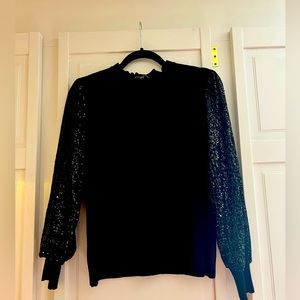 Adrianna Papell black knit top with full sequin sleeves
